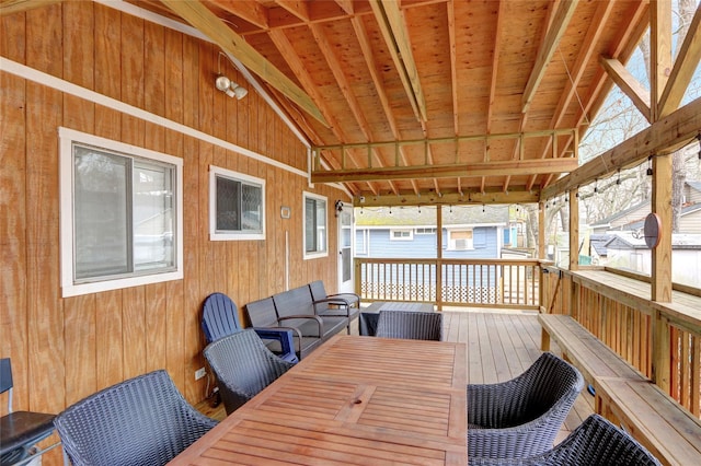 wooden terrace featuring outdoor dining space