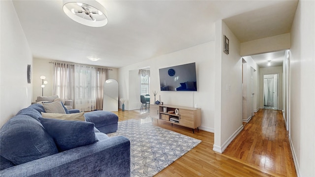 living room featuring light wood finished floors and baseboards