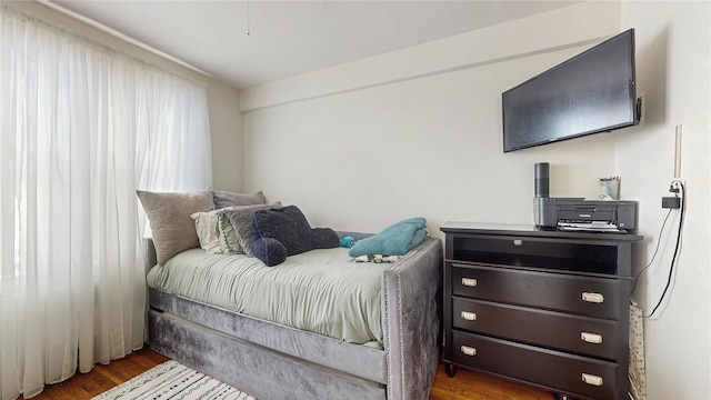 bedroom featuring wood finished floors