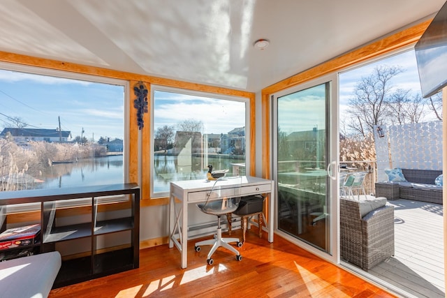 home office featuring wood finished floors and baseboards