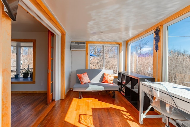 sunroom / solarium featuring a wall unit AC