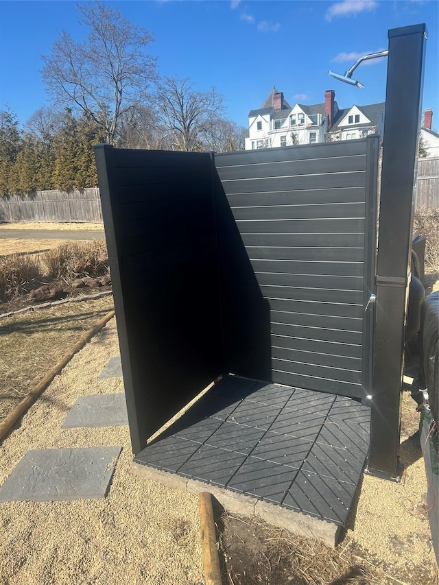 view of storm shelter with fence