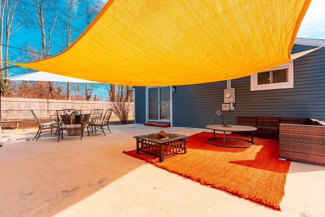 view of patio / terrace with outdoor dining area and fence