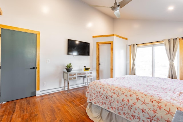 bedroom with lofted ceiling, a baseboard radiator, wood finished floors, and a ceiling fan