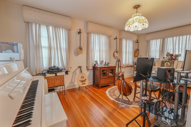 office area with wood finished floors and baseboards