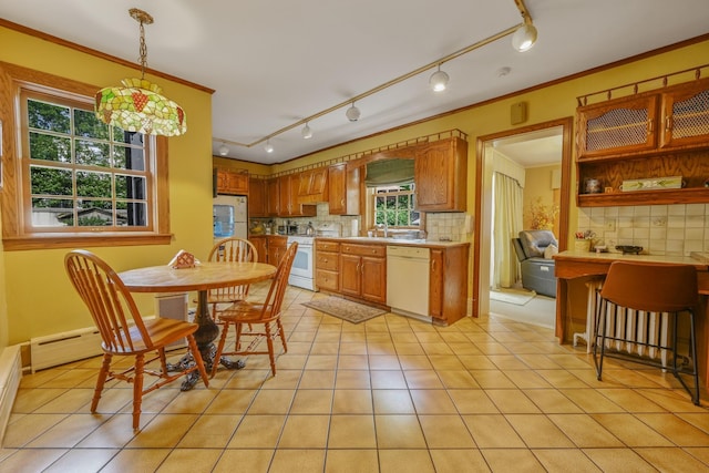 kitchen featuring light countertops, white appliances, decorative backsplash, and crown molding