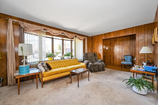 living area featuring carpet floors and wooden walls