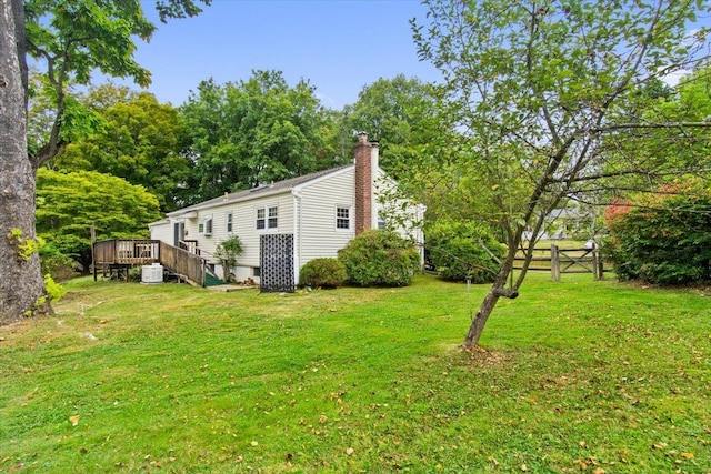 exterior space with a deck and fence