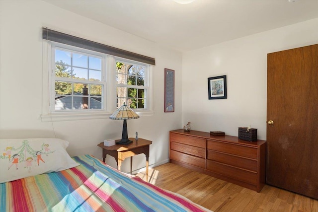 bedroom with light wood-style floors