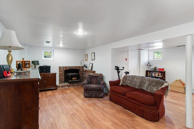 living room with light wood-style flooring and visible vents