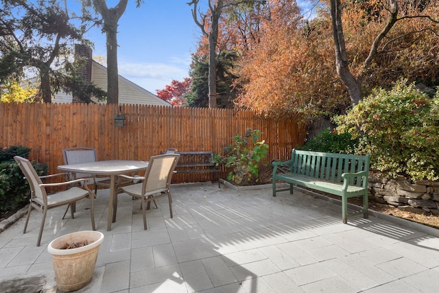 view of patio / terrace featuring fence and outdoor dining space