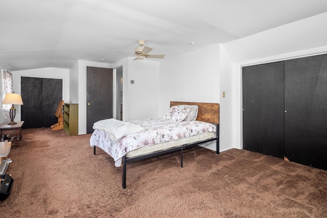 carpeted bedroom with lofted ceiling and a ceiling fan