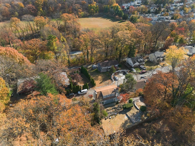 aerial view featuring a wooded view