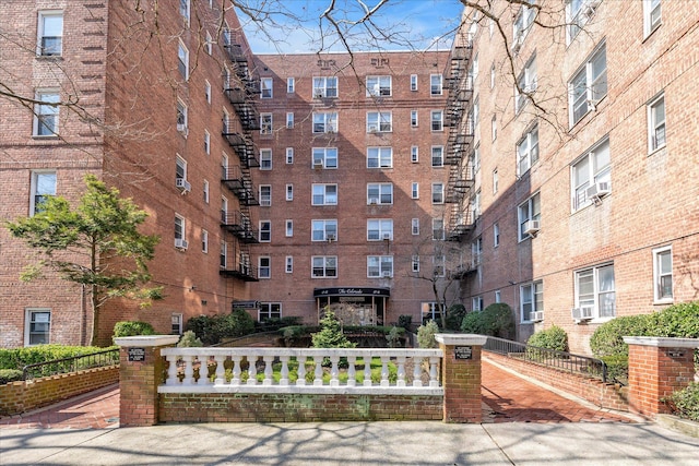 view of building exterior with fence