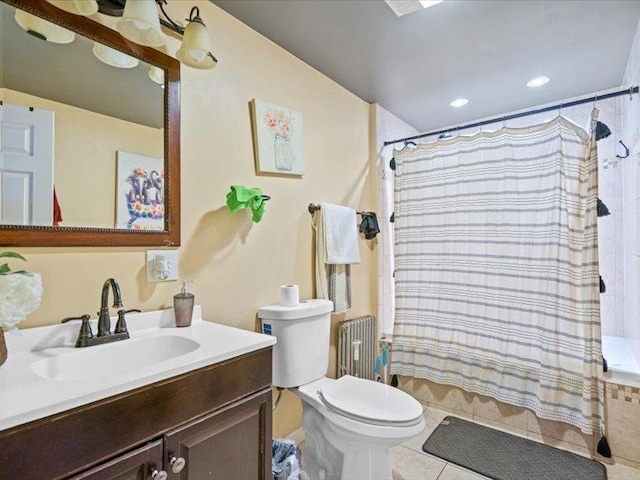 bathroom featuring radiator, toilet, tile patterned floors, vanity, and recessed lighting