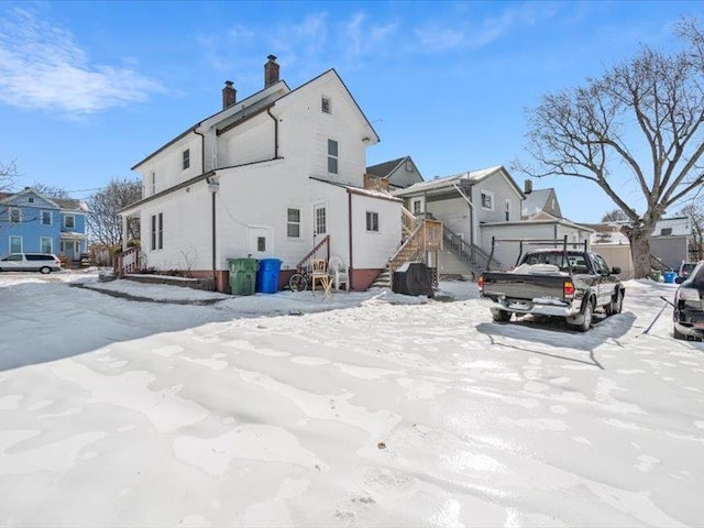 exterior space with a residential view and a chimney