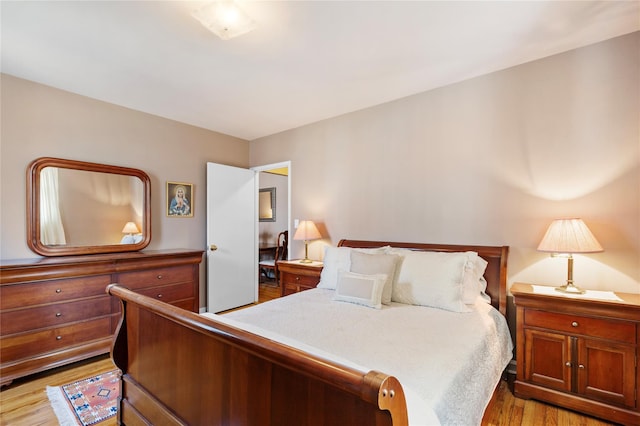 bedroom with light wood-type flooring