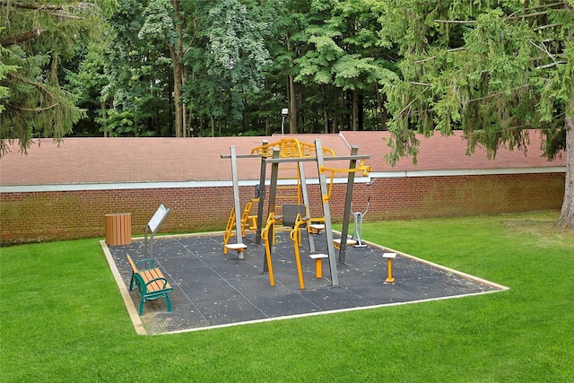 community jungle gym featuring a yard