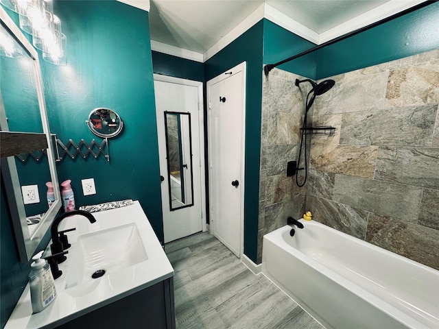 bathroom with vanity, shower / bath combination, and wood finished floors