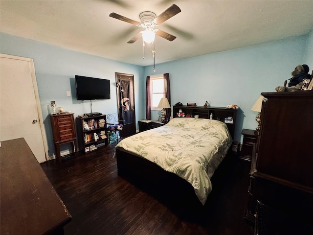 bedroom featuring dark wood-type flooring and ceiling fan