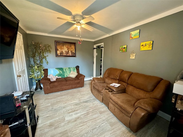 living room featuring ceiling fan, baseboard heating, baseboards, wood finished floors, and ornamental molding