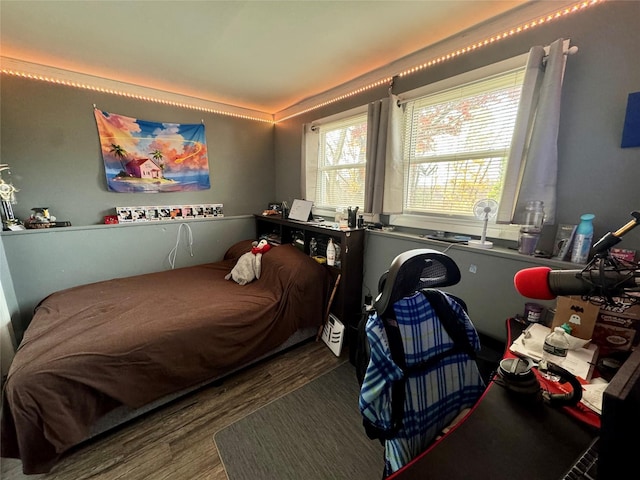 bedroom featuring wood finished floors