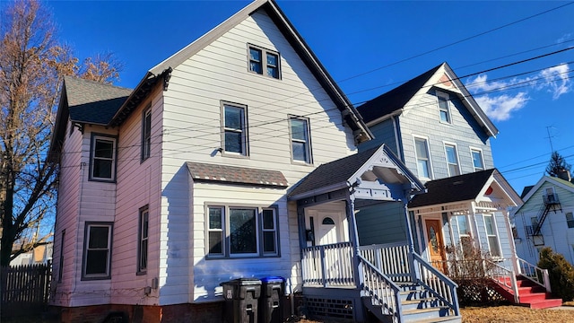 view of front of house featuring roof with shingles