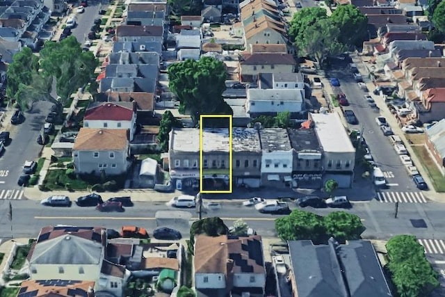 birds eye view of property with a residential view