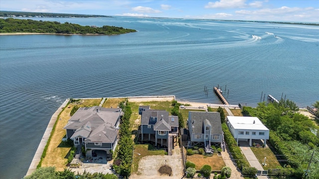 drone / aerial view with a water view and a residential view