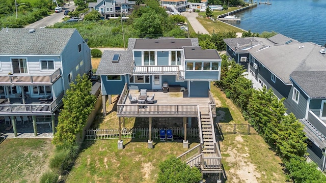 aerial view with a residential view and a water view