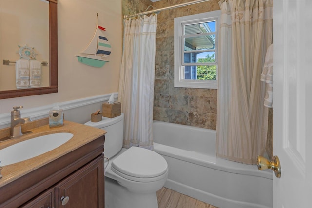 bathroom featuring shower / bath combo, vanity, and toilet