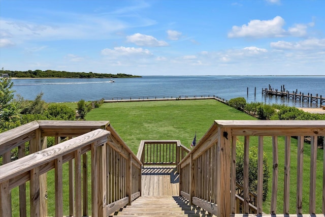 exterior space with a water view and a yard