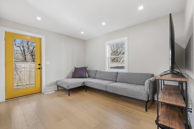 living room featuring recessed lighting and light wood-style floors