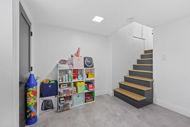rec room featuring baseboards