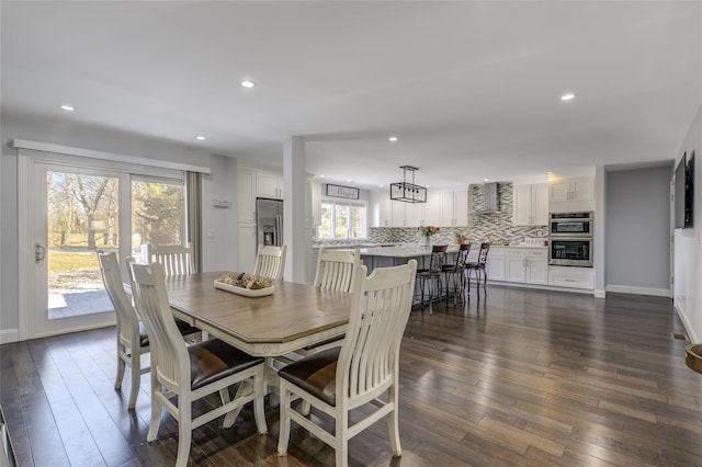 dining area featuring baseboards, dark wood-type flooring, and recessed lighting