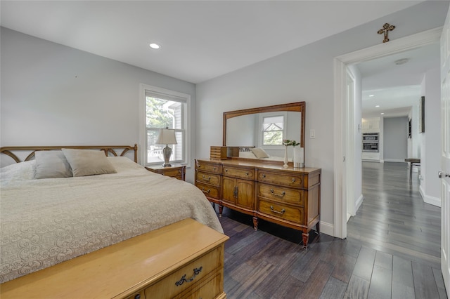 bedroom featuring dark wood-style floors, recessed lighting, and baseboards