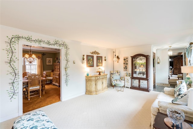 carpeted living area with a chandelier, ornamental molding, and baseboards