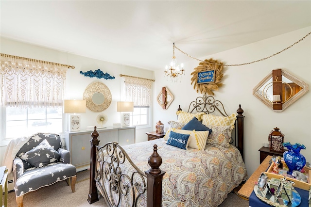 bedroom featuring carpet floors and an inviting chandelier