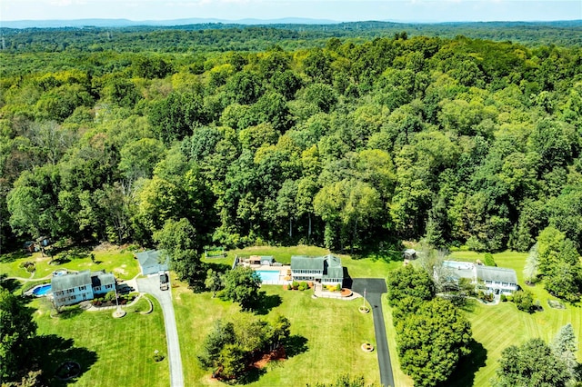 birds eye view of property with a forest view