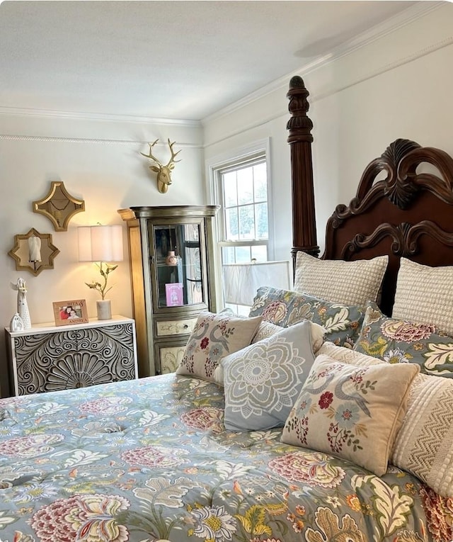 bedroom with ornamental molding