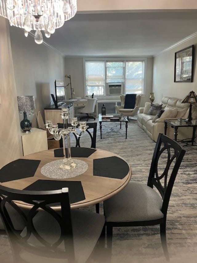 dining room featuring an inviting chandelier and ornamental molding