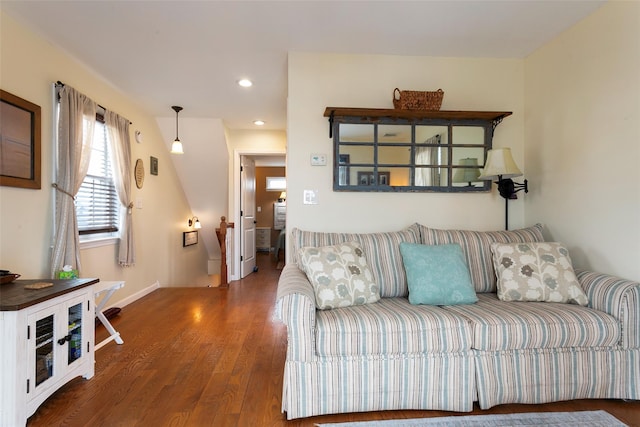 living area featuring recessed lighting, baseboards, and wood finished floors