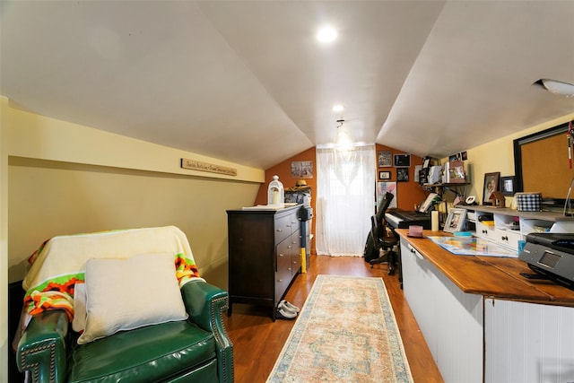 kitchen with butcher block countertops, vaulted ceiling, wood finished floors, and recessed lighting