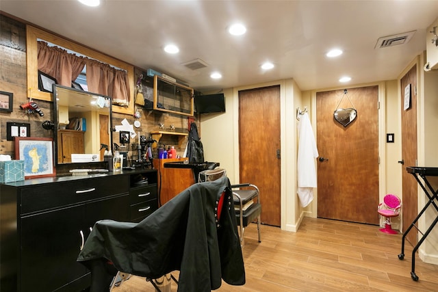 kitchen featuring recessed lighting, dark countertops, visible vents, light wood-style floors, and dark cabinetry