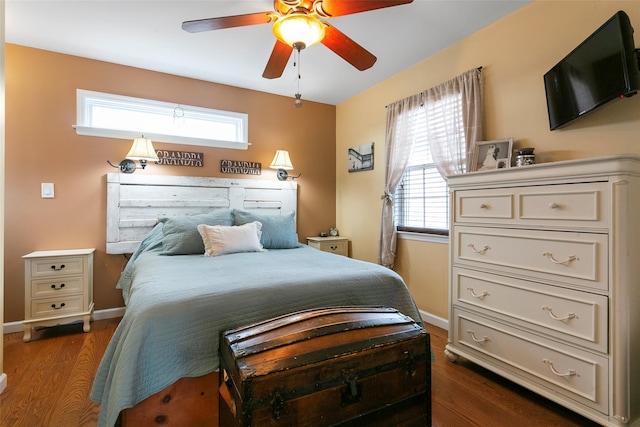 bedroom featuring dark wood-style floors, ceiling fan, and baseboards