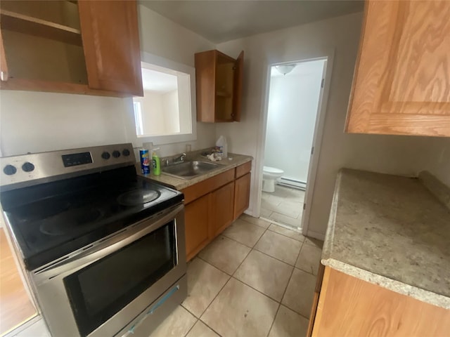 kitchen featuring a baseboard heating unit, a sink, stainless steel range with electric cooktop, light countertops, and open shelves