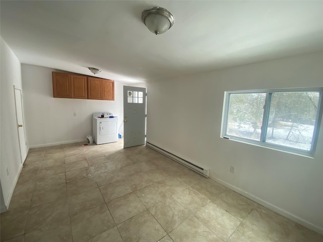 interior space featuring washer / clothes dryer, baseboard heating, and baseboards