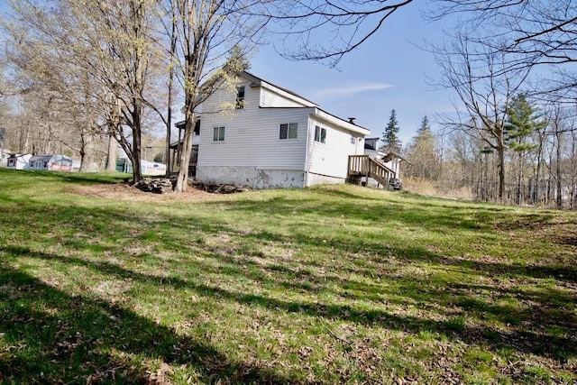 5 Plank Rd, Mongaup Valley, NY 12762 - view of home's exterior featuring a lawn