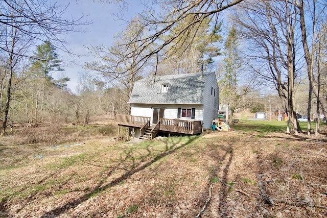 5 Plank Rd, Mongaup Valley, NY 12762 - rear view of property featuring a wooden deck, a gambrel roof, and roof with shingles