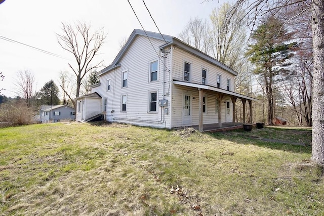 5 Plank Rd, Mongaup Valley, NY 12762 - view of side of property with covered porch and a lawn